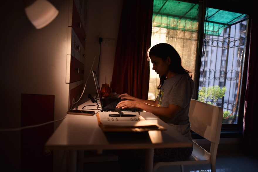 Woman working from home during lockdown to prevent spread of Corona virus