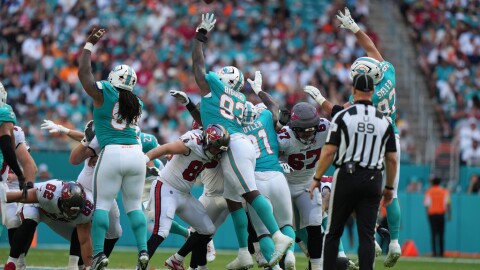Miami Dolphins defensive tackle Zeek Biggers (93) blocks a field goal-attempt by the Tampa Bay Buccaneers during the first half Sunday, Dec. 28, 2025, in Miami Gardens.
