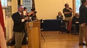Auctioneer Jimmie Dean Coffey works during the Rogers estate auction