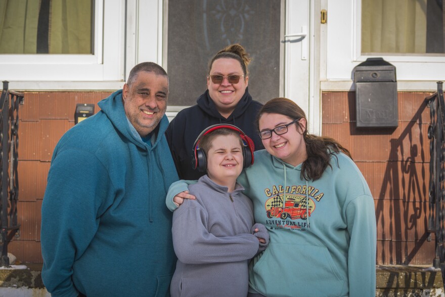  Pictured is Edward H. Speidel (left), Amy Szafranski (back) and their youngest child J.S. (center) and eldest child Katelyn Speidel (right) outside of their home in South Buffalo on January 26, 2021. Edward and Amy also have two middle children who are not pictured.

