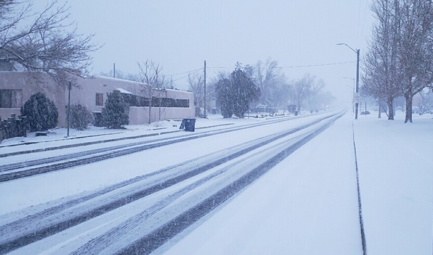 Snow accumulates on Gibson Blvd. in Albuquerque on Wednesday, Feb. 2, 2022