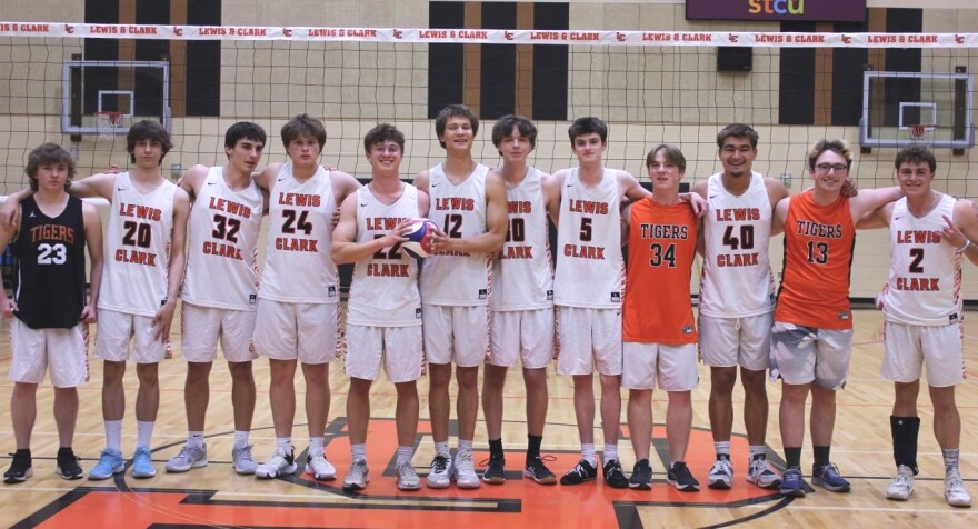 The Lewis and Clark High School boys' volleyball club team in its home gym