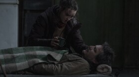 Ellie (played by Bella Ramsay) tends to a wounded Joel (Pedro Pascal) in episode 8 of "The Last of Us." (Courtesy of HBO)