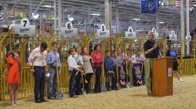 Indiana Gov. Eric Holcomb speaks at the groundbreaking for the Indiana State Fairgrounds’ new Fall Creek Pavilion, which will replace the century-old Swine Barn on Friday, Aug. 6, 2021 in Indianapolis. The project is part of a historic building spree soon to begin in Indiana after state legislators set aside more than $1 billion for construction endeavors.