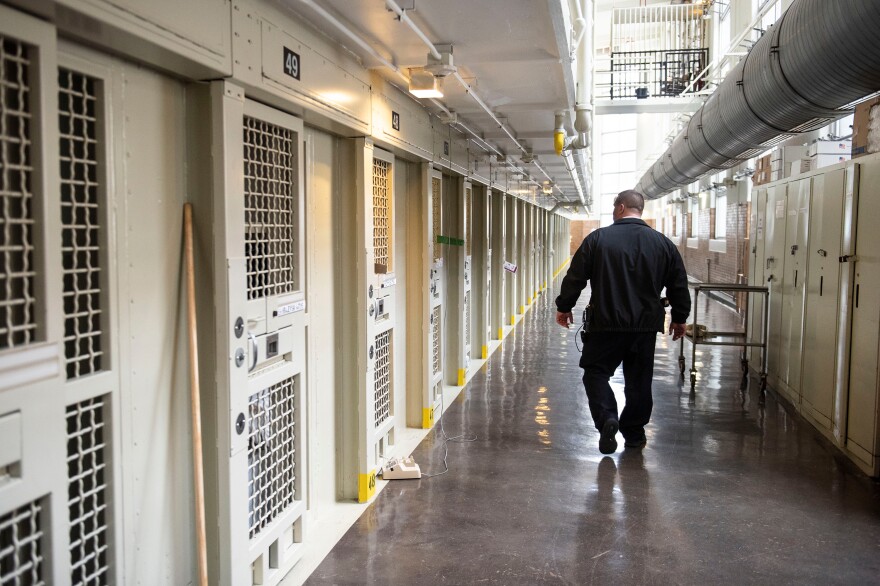 Lt. Keith Immerfall walks past prison cells at Waupun Correctional Institution, a maximum security prison in Waupun, Wis. If the more than 1,200 prisoners at the facility are still incarcerated there on April 1, the next Census Day, the Census Bureau will officially consider them residents of Waupun for the 2020 national head count.
