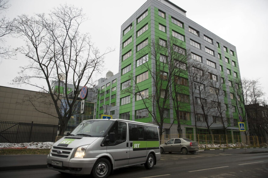 A car of Russian state-owned television station RT passes by the company's office in Moscow, Russia, Friday, Oct. 27, 2017. Twitter said on Thursday it would ban ads from RT and Sputnik, two state-sponsored Russian news outlets that the U.S. intelligence community has said tried to interfere with the 2016 U.S. presidential election. (Pavel Golovkin/AP)