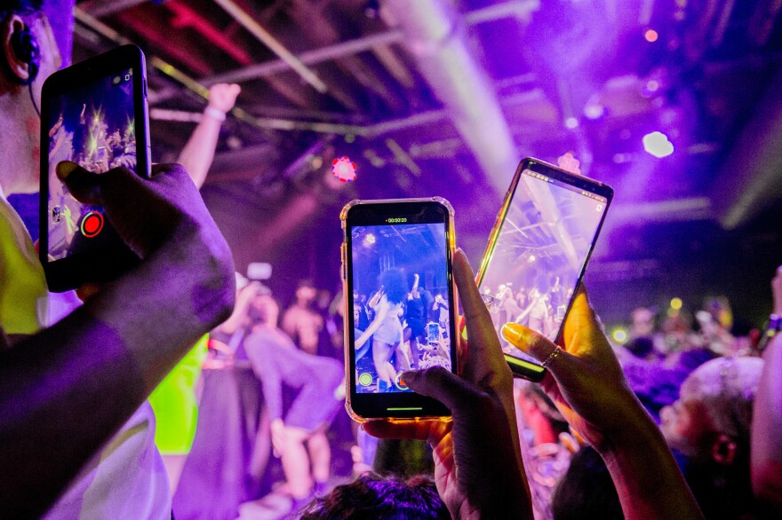 LONDON, ENGLAND - JULY 01: General atmosphere inside as fans tak photographs of Megan Thee Stallion performing on stage at XOYO during her first show in the UK on July 1, 2019 in London, England. (Photo by Ollie Millington/Getty Images)