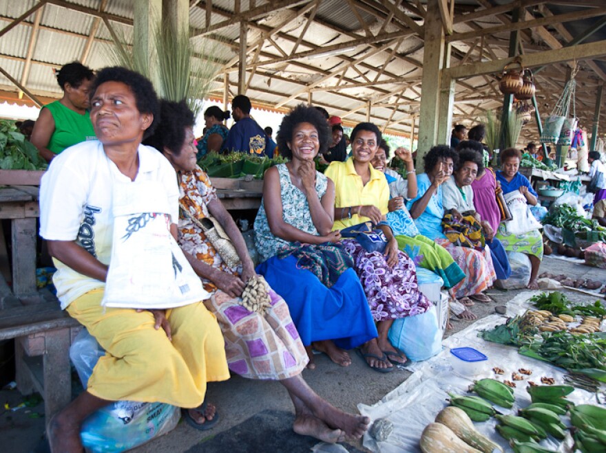 While some villages that cater to tourists have areas that discourage Western dress, many Papua New Guineans, like these women at a market not frequented by tourists, do wear modern clothes.