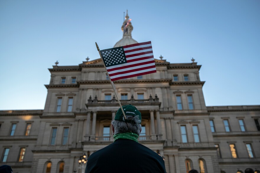 Protesters attend a "Count On Us" rally at the Michigan State Capitol building on November 04 in Lansing, Mich.