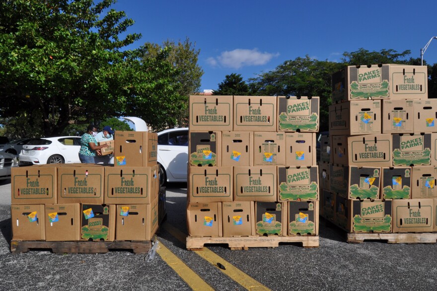 Boxes of food from Feeding South Florida wait to be handed out at San Lázaro Church in Hialeah on Nov. 18, 2020.