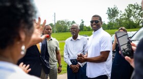 Environmental Protection Agency head Michael Regan smiles at Louisiana environmental justice advocates before announcing plans for new regulations on the chemical manufacturing industry during a visit to LaPlace, Louisiana on Thursday, April 6, 2023.