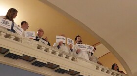 Medical professionals protest during a Make Oklahoma Health Again press conference at the State Capitol.