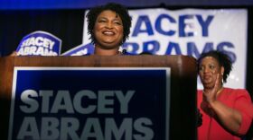 Then-Georgia Democratic gubernatorial candidate Stacey Abrams takes the stage to declare victory in the primary during an election night event in May 2018.
