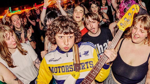 Issley Manzi plays a guitar at a previous Queercore fest
