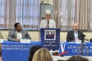 Moderator Roberta Parks from the League of Women Voters of Greater Peoria speaks during a Peoria Public Schools school board candidate forum Saturday. The candidates are (from left) Andy Diaz, David Daye, Doug Shannon and Sarah Howard.