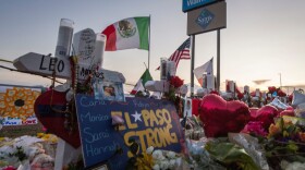 People pray and pay their respects at the makeshift memorial for victims of the shooting that left a total of 22 people dead at the Cielo Vista Mall WalMart in El Paso, Texas, on August 6, 2019. (Mark Ralston/AFP via Getty Images)