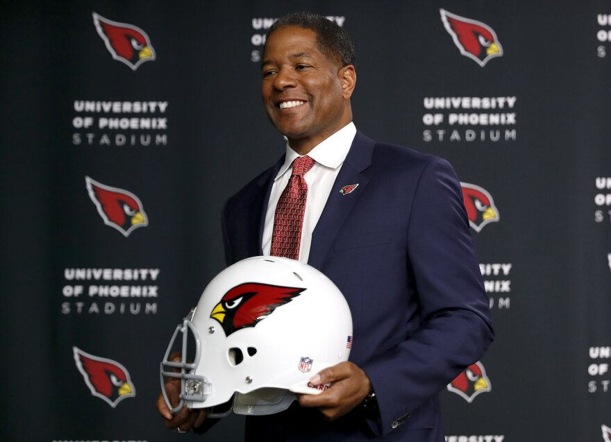 New Arizona Cardinals NFL football head coach Steve Wilks poses for photographers, Tuesday, Jan. 23, 2018, after being introduced at the teams' training facility in Tempe, Ariz.