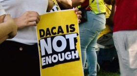 "DACA is not enough" sign
