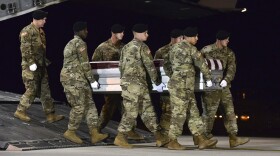 A U.S. Army team transfers the remains of Army Staff Sgt. Dustin Wright upon arrival at Dover Air Force Base, Del.  (Staff Sgt. Aaron J. Jenne/U.S. Air Force via AP)