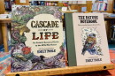 Cascade of Life: An Artist's Seasonal Guide to the Wild Northwest sits next to The Nature Notebook