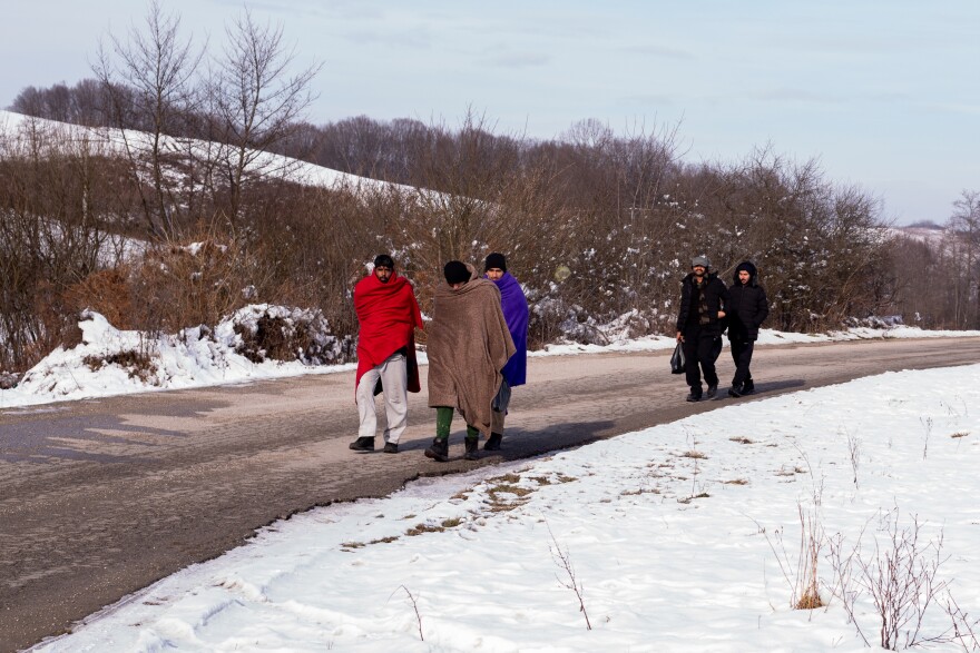 A group of Egyptian migrants walk in the Pozvizc area, near the Croatian border, making their way back to the city of Bihac. They were just pushed back into Bosnia from Croatian border police. They said police officers beat them up when they discovered them.