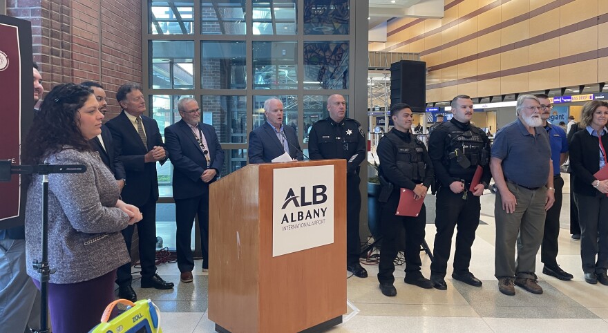 John Bonhatal (R) with the first responders and speakers at Thursday's press conference
