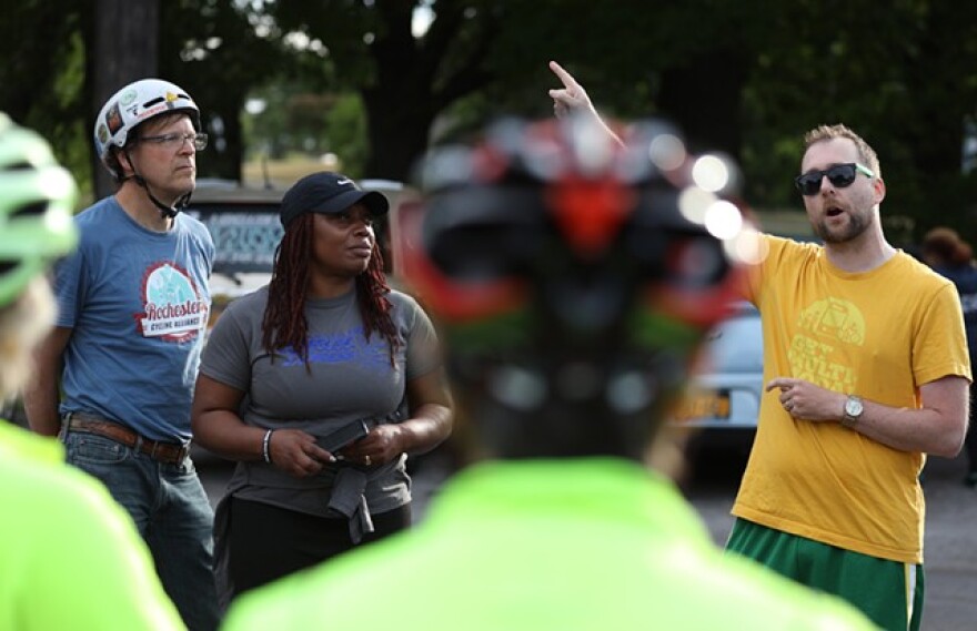 Jesse Peers with Reconnect Rochester outlines the route for bike riders before leaving Maplewood Park to ride along the Genesee River.