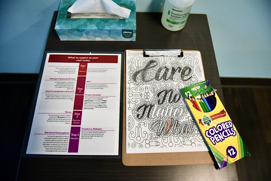 Instructions on what to expect during a visit to Planned Parenthood Great Plains sits on a desk in the waiting room in June 2024 in Overland Park, Kansas.