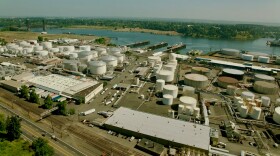 Overhead view of industrial area with tanks and trucks