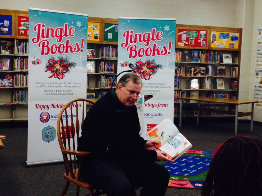 Indianapolis Mayor Greg Ballard reads the Dr. Seuss book "Green Eggs and Ham" to children at Indianapolis Public Library's Eagle Branch on Tuesday, Dec. 16, 2014.