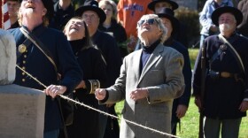 Norm Kelly, center, participates in the unveiling and dedication of a fully restored Civil War monument, 'The Shaft,' in October at Peoria's Springdale Cemetery.