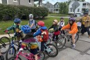The Pleasant Ridge Bike Bus pauses on Kincaid Road as a new rider joins the group.
