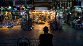 A shop owner waits for customers in a market in the resort town of Sharm el-Sheikh, Egypt. Over the past nine months, tourism has plummeted in the country after a series of deadly attacks.