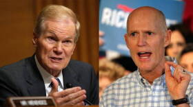 Bill Nelson (left) concedes defeat to Rick Scott (right)