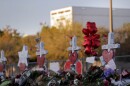 A memorial is made outside the Marjory Stoneman Douglas High School where students and faculty were killed in a mass shooting.