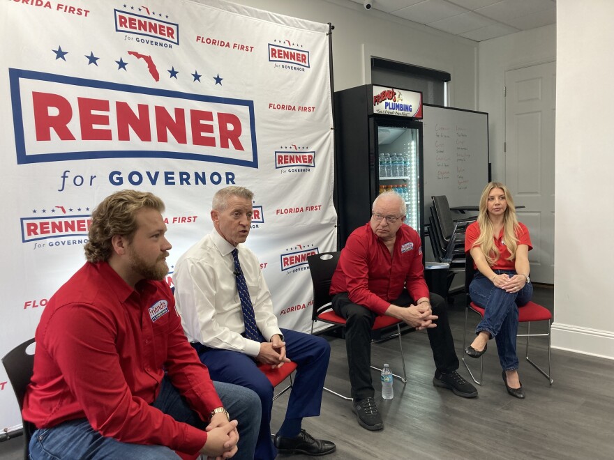 Man seated with three other people