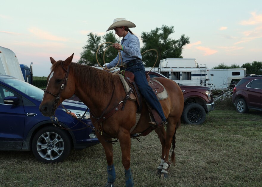 Rachel Brownback and her horse, JD, prepare for the breakaway roping at the Hepler Ruritan Club Rodeo. Brownback is atop JD and practicing with her rope.