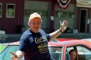 Cooter, actor Ben Jones, sits atop one of the 229 hotrods, named the General Lee, used in the show "Dukes of Hazzard" as ecstatic fan, Aliceson Johnson, of Charlottesville, Va., sits in the drivers seat in front of his store in Sperryville, Va., Tuesday, Aug. 10, 1999.