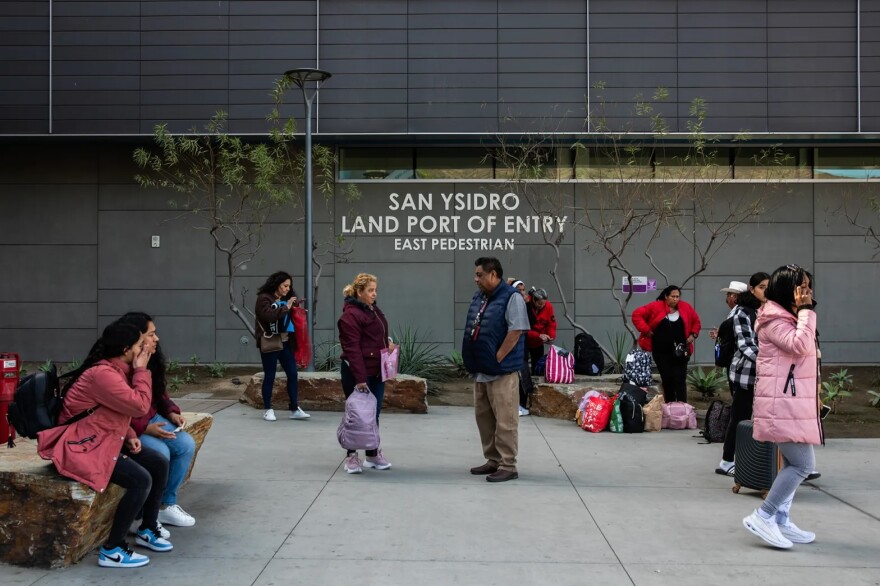 People wait outside the San Ysidro Port of Entry in San Diego on Jan. 20, 2025.