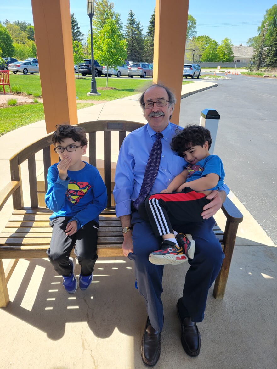 Rabbi Marc Berkson and his grandkids Ezra and Isaac at a "glean machine" event, which also coincided with "Superman Sunday."