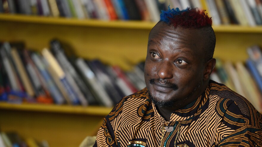 Kenyan author Binyavanga Wainaina, seen here during a January 2014 interview in Nairobi, has died at the age of 48. A founder of the Nairobi-based literary network <em>Kwani?</em>, Wainaina had come out as gay in a country where homosexuality was illegal.