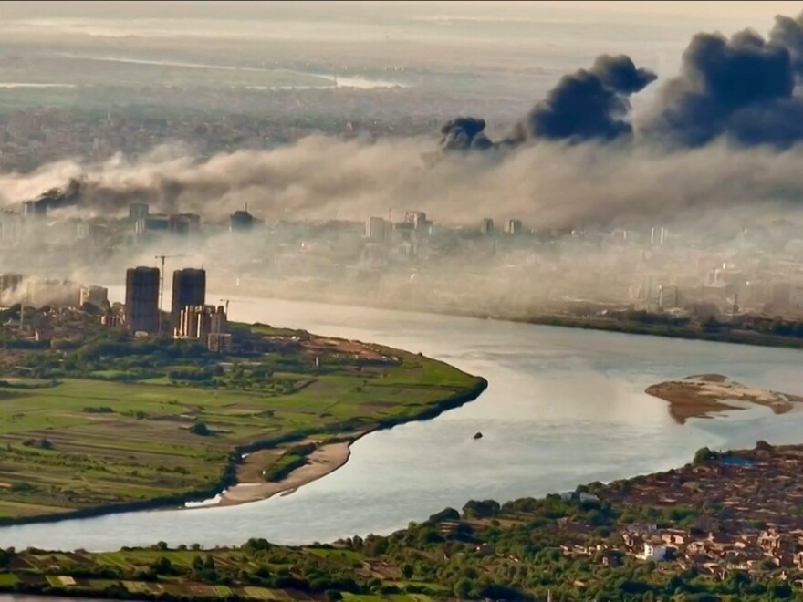 This video grab taken from AFPTV video footage on April 19 shows an aerial view of black smoke covering the sky above the capital Khartoum.