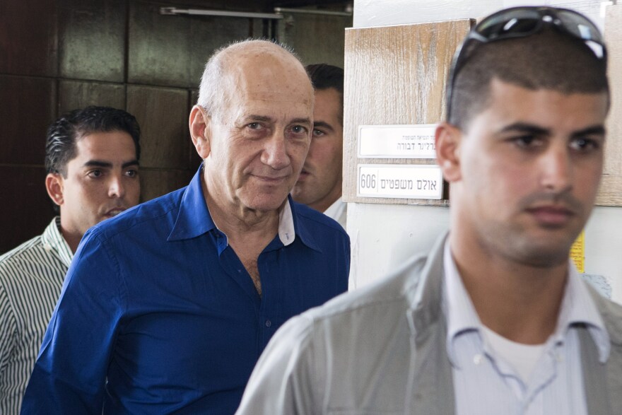 Former Israeli Prime Minister Ehud Olmert leaves Tel Aviv's district court Wednesday. Olmert was sentenced to six years in prison and a fine of 1 million shekels ($290,000) for his role in one of the country's worst-ever corruption scandals.