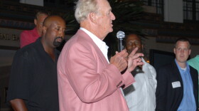 Indiana basketball coach Mike Woodson, left, looks on as former IU standout Bob Leonard speaks at a men's basketball reunion in 2008 in French Lick.