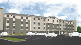 A rendering shows the proposed Woodspring Suites extended-stay hotel to be built at 1180 Jefferson Road in Henrietta.