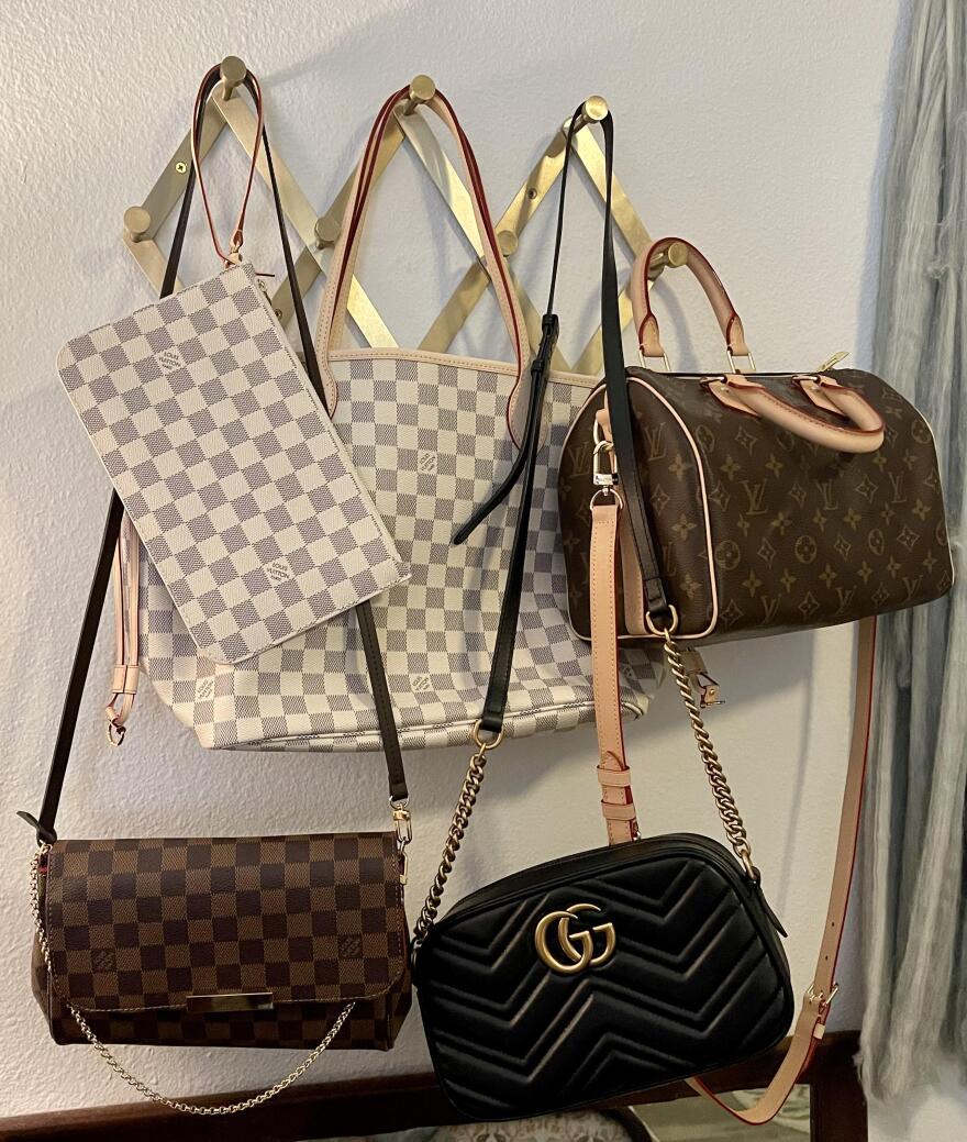 A collection of replica handbags: Louis Vuitton Favorite in Damier Ebene, Louis Vuitton Neverfull and its pouch in Damier Azur, Gucci Marmont, and Louis Vuitton Speedy 25. (Photo courtesy of Laura Elizabeth)