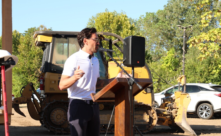 Talon Manigas, president of the Watered Gardens' board of directors, speaks at the groundbreaking for Freedom Village on September 4.