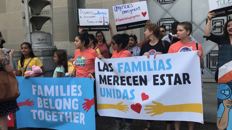 More than 100 people chanted and sang outside a Justice Department building in Washington, D.C., on Friday. The protesters gathered to condemn the Trump administration's practice of separating immigrant parents and children at the Southern border.