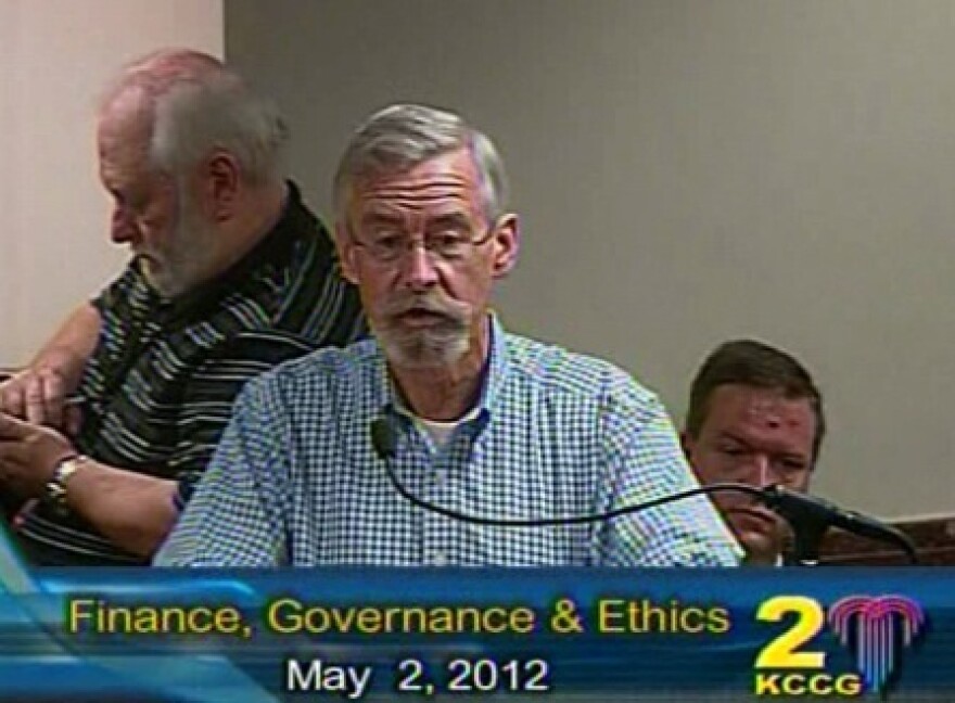Dan Cofran of Kansas City Citizens Association at microphone, pleased with firefighters labor pact.