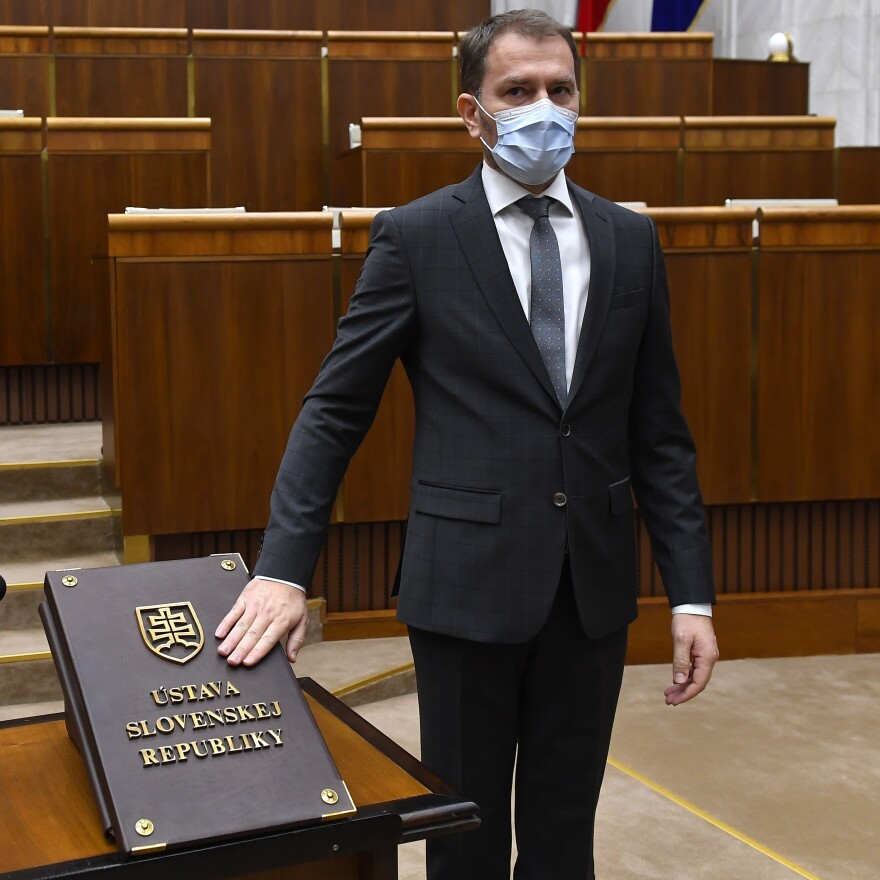 Slovakian Prime Minister Igor Matovic, while wearing a face mask, takes the oath during the inaugural session of the new Parliament in Bratislava last month.